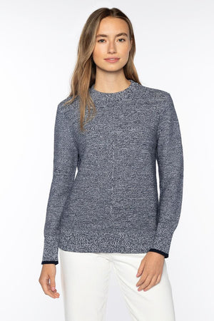 A woman with long, light brown hair wears the KINROSS MARLED MICRO GARTER CREW NECK COTTON SWEATER in navy and white pants, standing facing forward against a plain white background with a neutral expression.