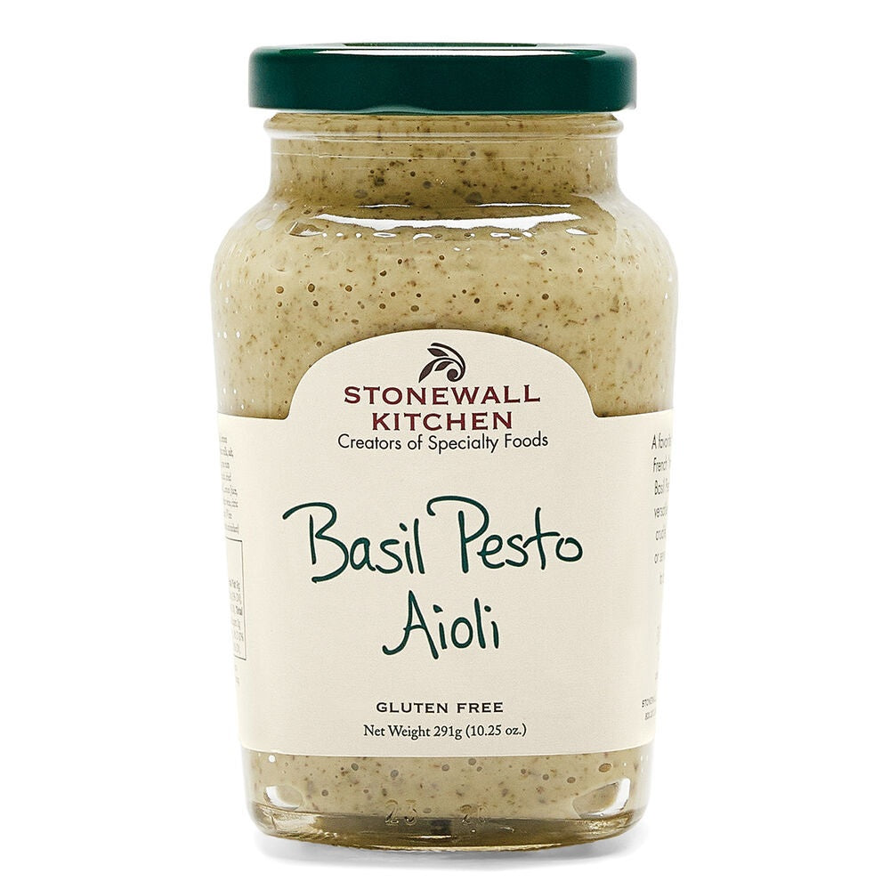 A glass jar of STONEWALL KITCHEN - BASIL PESTO AIOLI with a green lid features a white label displaying the product name, gluten-free notation, and 291g (10.25 oz) net weight. This French mayo-inspired aioli is perfect as a dip for vegetables, a spread for sandwiches, or to add flavorful basil pesto taste to your favorite dishes.