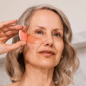 The OMNILUX EYE BRIGHTENER HYDROCOLLOID REFILL PACK packaging features a patch illustration on a beige background with blue patterns and arrows, highlighting the brand name, product details, and skin-rejuvenating peptides rich in amino acids.