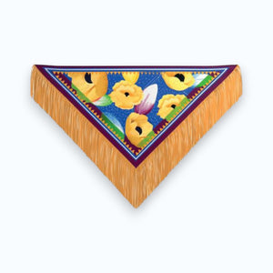 The FRANCO FERRARI - SILK FRINGE SCARF is an Italian-made luxury accessory, featuring bright blue silk with large yellow flowers, green leaves, purple and red borders, and long golden fringe on the edges.