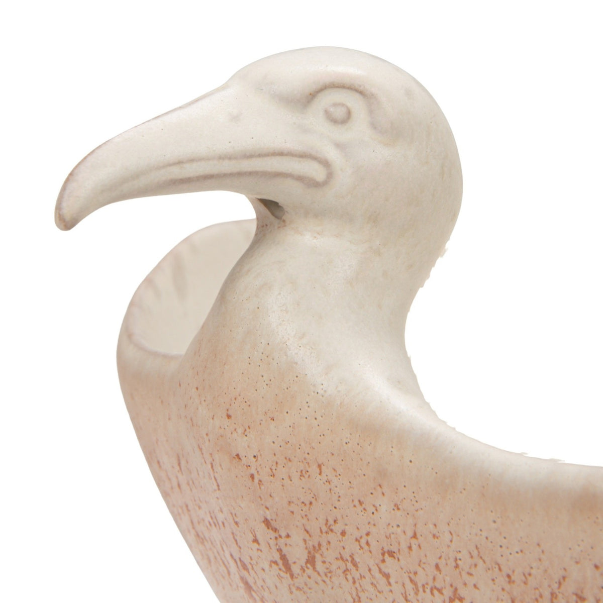 A close-up of the CREATIVE COOP WHITE SPECKLED BIRD-SHAPED STONEWARE FOOTED BOWL, featuring a gull-inspired design with a long beak and a smooth beige and light brown reactive glaze.