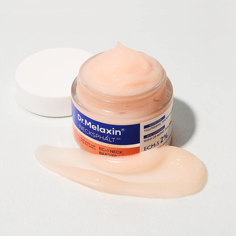 An open jar of KOSMIC KBEAUTY SKINCARE DR MELAXIN - NECKSPHALT ECM NECK BARRIER CREAM with light peach cream spread on the white surface in front of it.