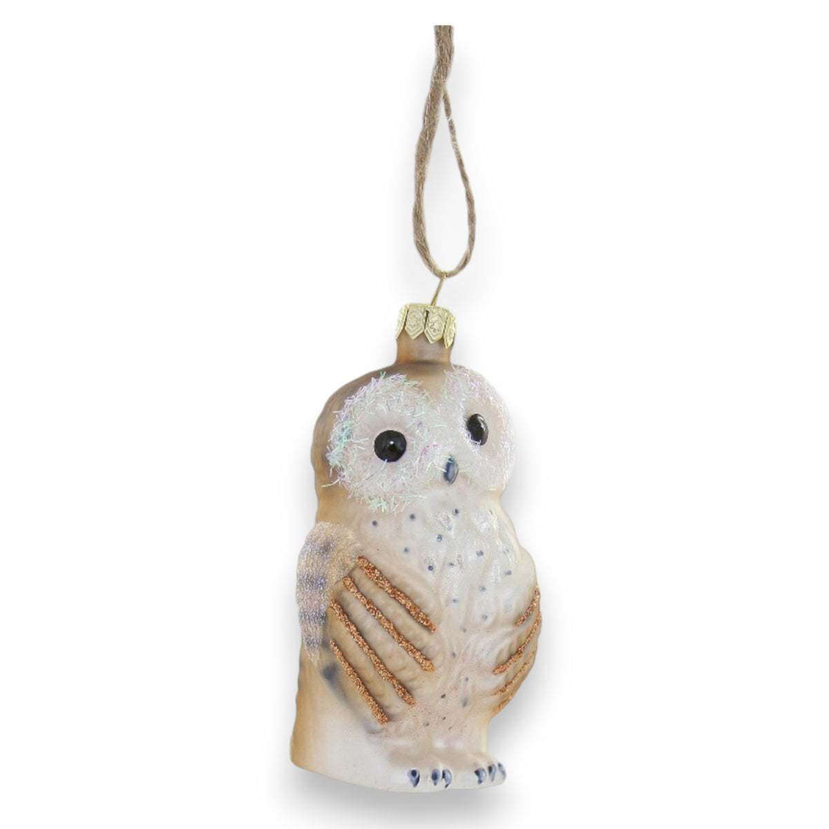 The BASHFUL OWL ORNAMENT by CODY FOSTER features a brown and white owl with glittery accents, black eyes, and a gold cap on twine—perfect for collectors or as a cherished keepsake. Set against a white background.