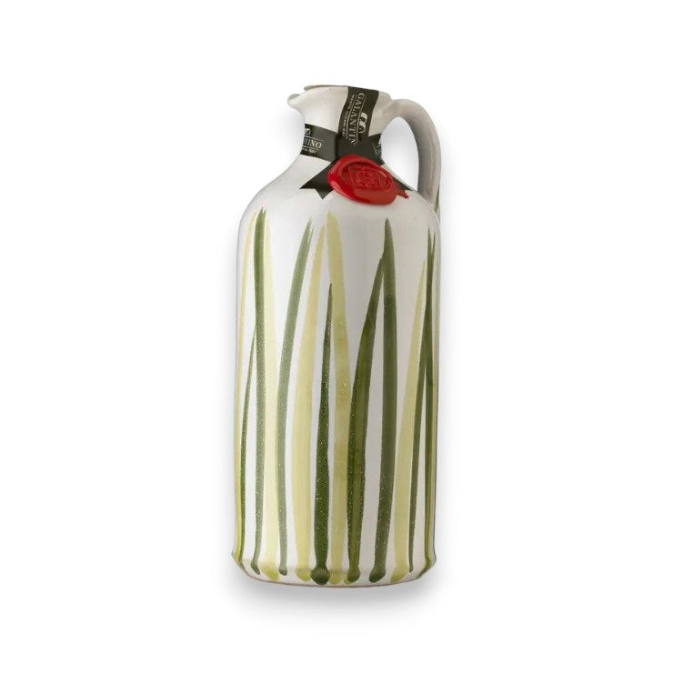 A tall, hand-painted ceramic bottle from Zia Pia Imports features a handle and is adorned with vertical green reed-like patterns. It bears a black and white label near the spout and is sealed with red wax. This exquisite piece, named Gallantino - Extra Virgin Olive Oil, comes filled with premium extra virgin olive oil.
