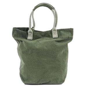 The TRAVAUX EN COURS CANVAS TOTE BAG is a versatile teal accessory with beige 100% cotton canvas handles. It features a spacious main compartment, with securely stitched handles ideal for carrying by hand or over the shoulder.