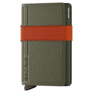 The SECRID - BANDWALLET LIBA® IN GREEN AND ORANGE by SECRID features an open, slim design with visible euro banknotes and three credit cards organized in dedicated slots. This wallet includes sections for both cash and cards and offers RFID protection to keep your information secure.