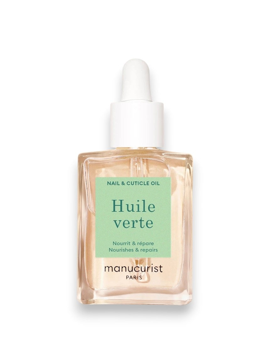 A pink background displays MANICURIST - HUITE VERTE NOURISHING CUTICLE OIL by MANUCURIST INC, featuring sweet almond, kukui nut, baobab seed, walnut, passion fruit, and coconut oils for nail hydration. Clear liquid drops are shown close-up.