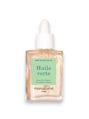 A pink background displays MANICURIST - HUITE VERTE NOURISHING CUTICLE OIL by MANUCURIST INC, featuring sweet almond, kukui nut, baobab seed, walnut, passion fruit, and coconut oils for nail hydration. Clear liquid drops are shown close-up.