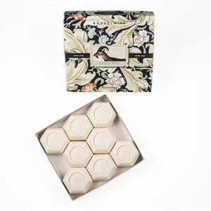 The BAUDELAIRE GOATS MILK HONEY SOAP 1.4OZ GIFT BOX includes eight hexagonal moisturizing soaps for sensitive skin in a vintage floral and bird-adorned box, offering classic charm and gentle care.