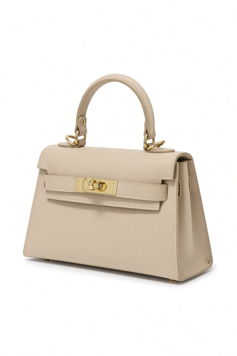 LE BORSETTE SMALL LEATHER SATCHEL BAG IN BEIGE, a structured leather satchel with a top handle and gold-tone metal clasp hardware.