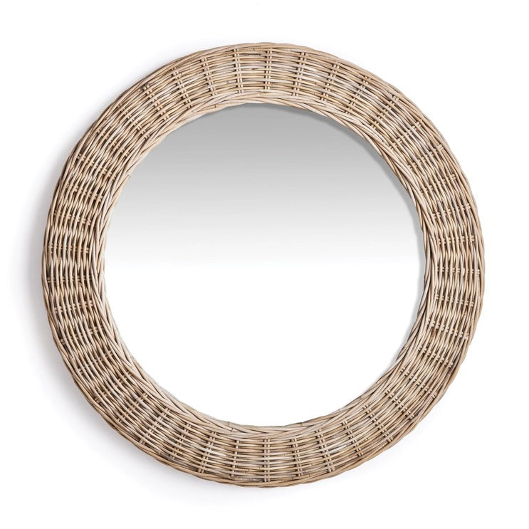 The NAPA HOME AND GARDEN - KYLAN ROUND MIRROR features a natural woven rattan frame, highlighting rustic texture against a white backdrop. Its simplicity and elegance make it ideal for any home decor.