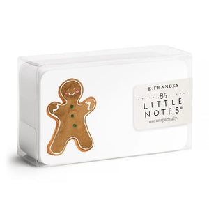 A transparent box contains 85 GINGERBREAD LITTLE NOTES, with the top notecard featuring a gingerbread man illustration, including a smiling face and three green buttons. A label on the box reads "E.FRANCES PAPER 85 Little Notes—use unsparingly.