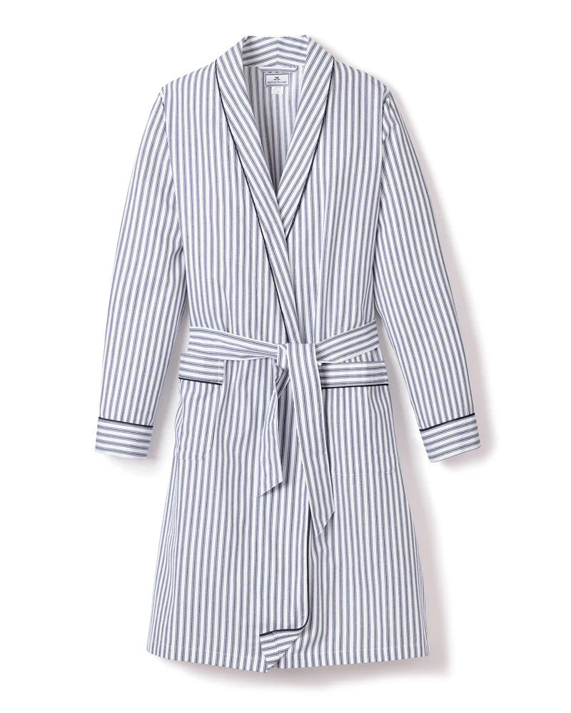 The FEARRINGTON LIFESTYLE COLLECTION - WOMEN&#39;S TWILL ROBE IN NAVY FRENCH TICKING by PETITE PLUME is a knee-length, long-sleeved robe with a tie belt at the waist. Crafted from the finest quality cotton, it features vertical navy and white stripes with matching striped cuffs on the sleeves. This piece of luxurious sleepwear boasts two front pockets and a shawl collar for added comfort.