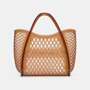 The DOLCE VITA - TOP HANDLE WHISKEY JELLY HANDBAG features a brown lattice design, curved handles, and “dolce vita” embossed on the front—a stylish, see-through tote perfect for vacations.
