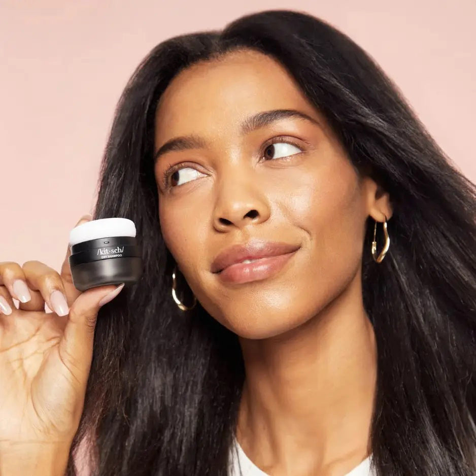 A black and gray cylindrical container of KITSCH Volumizing Rice Water Protein Dry Shampoo is set against a white background, elegantly displaying the KITSCH brand name on the front.
