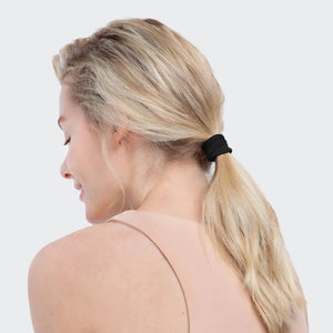 A 20-pack of KITSCH's eco-friendly nylon hair elastics, made from recycled materials, provides all-day hold. The minimalist packaging has a light background with "KITSCH" elegantly printed.