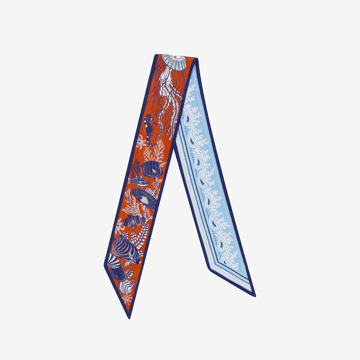 The INOUI EDITIONS - SILK RIBBON NEPTUNE by INOUI features vibrant sea life on an orange side and paisley with abstract designs on light blue, making it a stylish terracotta silk accessory.