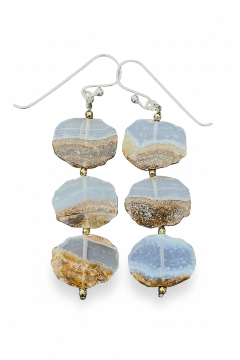 Introducing the ANN LIGHTFOOT - BLUE CHALCEDONY SLAB TRIPLE LAYER EARRINGS: a pair of dangle earrings from ANN LIGHTFOOT, featuring three flat, oval blue chalcedony stones stacked vertically and separated by small gold beads, all suspended from sterling silver earwires.