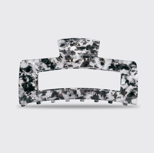 A rectangular, black marble-patterned KITSCH Eco Friendly Jumbo Open Shape Claw Clip, made from recycled materials, is displayed against a pale background with its “kitsch” branded packaging.