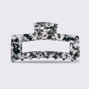 A rectangular, black marble-patterned KITSCH Eco Friendly Jumbo Open Shape Claw Clip, made from recycled materials, is displayed against a pale background with its “kitsch” branded packaging.