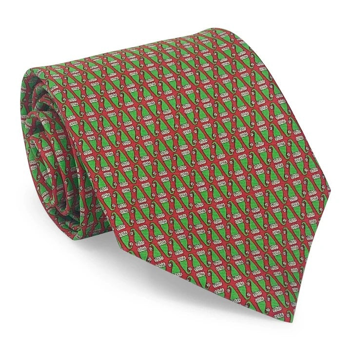 Introducing the BIRD DOG BAY PETER-BLAIR - SANTA HATS SILK TIE IN RED: a handcrafted silk tie adorned with a repeating pattern of festive red Santa hats, set against a vibrant red background. Handmade in New York, this spirited accessory is finished with an exclusive Peter-Blair woven label.