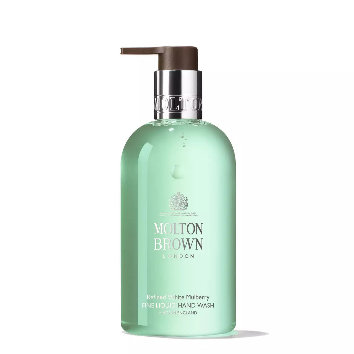 A clear pump bottle of Molton Brown White Mulberry and Thyme Hand Wash, enhanced with bergamot. The bottle contains green liquid, a silver neck, and a dark brown pump. The label indicates it is made in England.