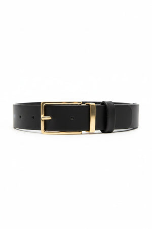 The ADA CHIC HORIZON BELT in black leather features a gold rectangular buckle and multiple adjustment holes, coiled neatly for versatile styling. This one-size accessory elegantly complements any outfit with its seamless fit across various measurements.