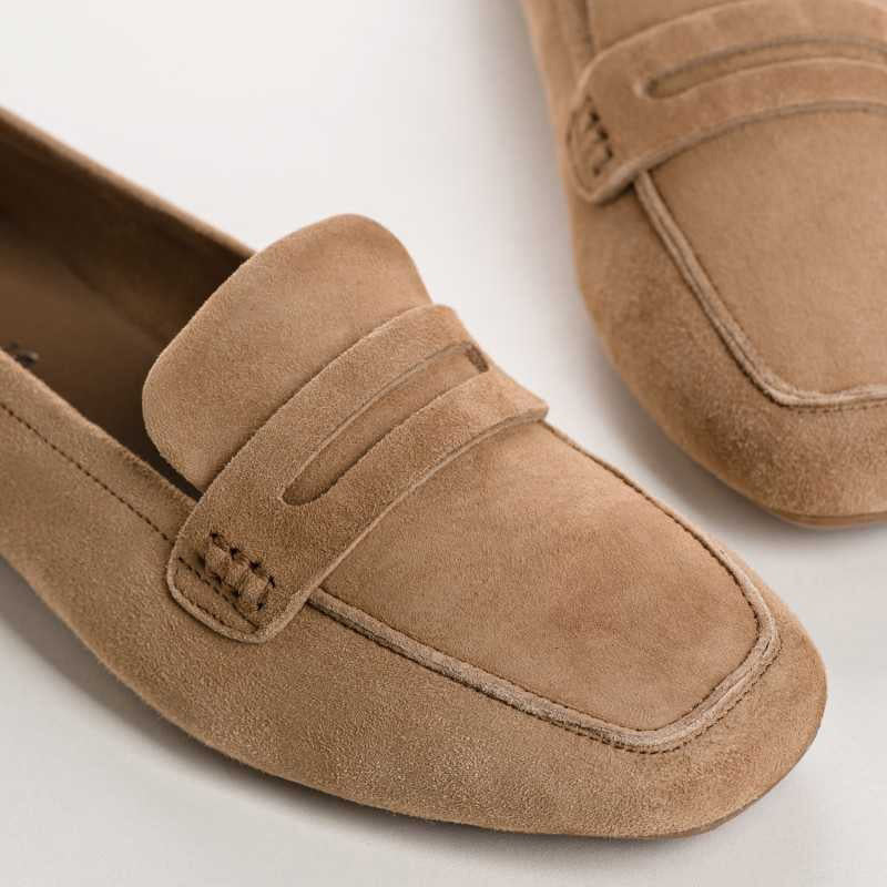 Top view of the REQINS - HEMA suede loafer in natural, featuring stitching details and a subtle branded leather insole, highlighting REQINS' craftsmanship against a plain white background.