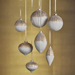 Six RIBBED TOW TONED GLASS TEAR FROP ORNAMENTs in round and teardrop shapes hang from ribbons, measuring 2.25 x 5.25 inches each with a metallic gold top half and a white glittery bottom half.