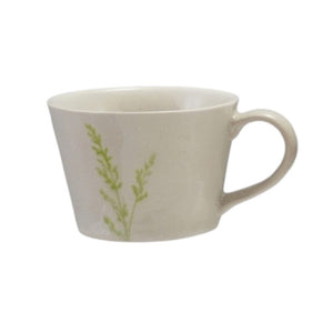 Four DEBOSSED STONEWARE MUGS WITH BOTANICAL PATTERN by CREATIVE COOP, featuring cream color, unique green botanical designs, and a subtle reactive glaze finish, are lined up side by side on a white background.
