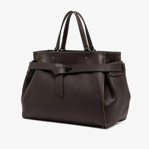 The GIANNI CHIARINI - MIRANDA HANDBAG IN ESPRESSO is a dark brown handbag crafted from pebbled, hammered leather, featuring two handles and a distinctive knotted strap detail across the front. It comes finished with a removable shoulder strap and is shown against a white background.