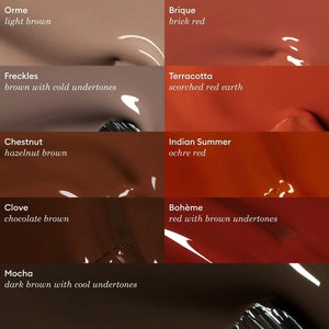 A bottle of MANUCURIST - GREEN™ Nail Polish in Clove by MANUCURIST INC, featuring a rich chocolate brown shade and a black cap. The label reads “green quick dry intense color.”.