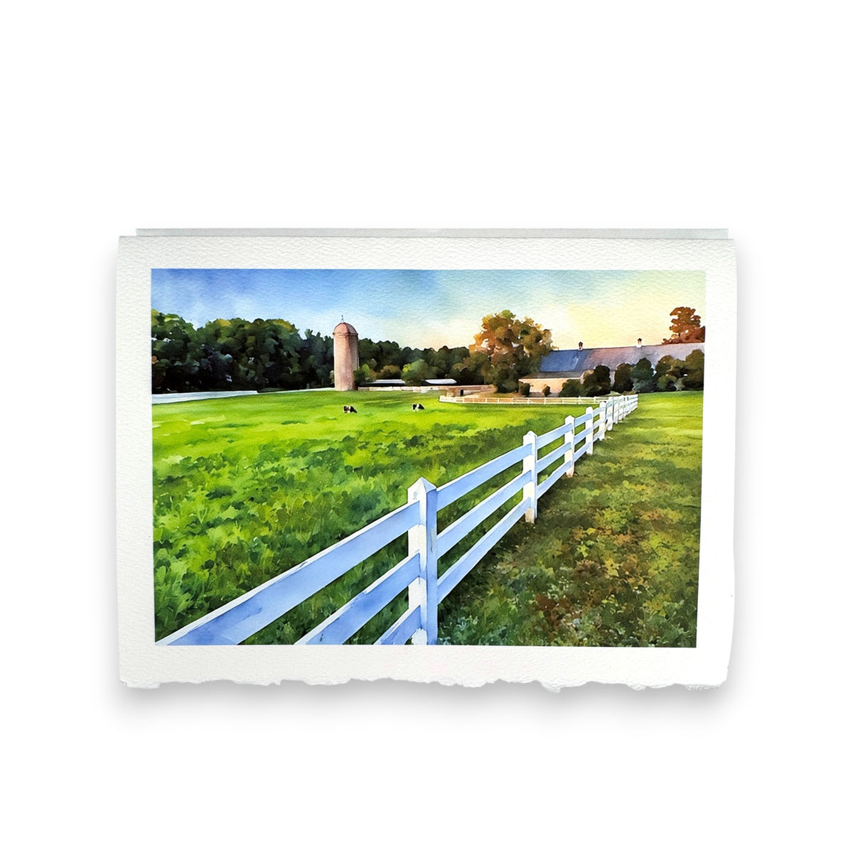 The FEARRINGTON SIGNATURE COLLECTION - WATERCOLOR GREETING CARD &quot;AFTER SUNRISE&quot; by PICTURE SALON features a farm scene with cows, barn, silo, and white fence—printed on premium cardstock for a stunning greeting.
