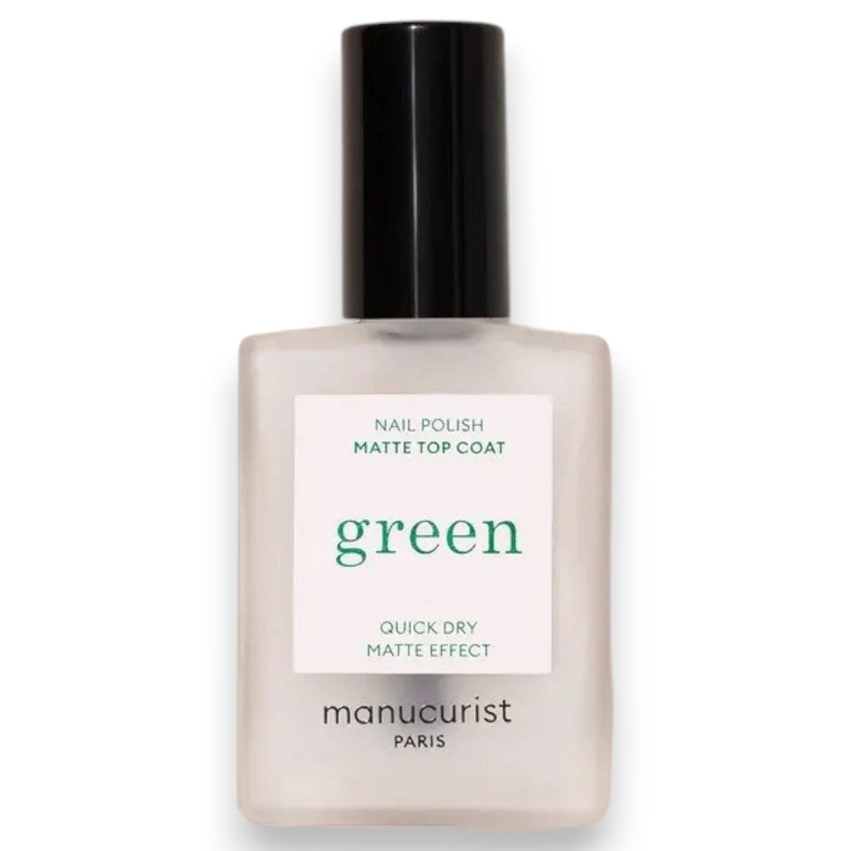 A hand with light blue painted nails holds a bottle of MANUCURIST - GREEN™ Nail Polish Matte Top Coat by MANUCURIST INC, featuring a black cap and clear plant-based formula, against a beige background.