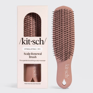 A KITSCH - Scalp Renewal Brush in Terracotta is displayed beside its box packaging, which features the product name and emphasizes its gentle, soothing scalp massage benefits as well as its eco-friendly materials. This nylon bristle brush by KITSCH is ideal for refreshing your scalp and effortlessly promoting healthy hair.