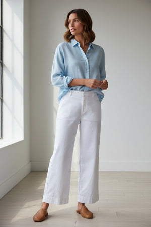 FRANK & EILEEN’s Wexford Wide Leg Linen Trouser in white features a high waist, straight relaxed fit, and minimal waistband for a clean look. Shown against a plain white background with no visible decorative details.
