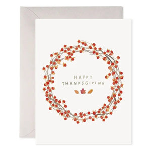 E. FRANCES - AUTUMN BERRY WREATH THANKSGIVING GREETING CARD featuring a watercolor wreath of autumn berries and leaves with “Happy Thanksgiving” written in the center.