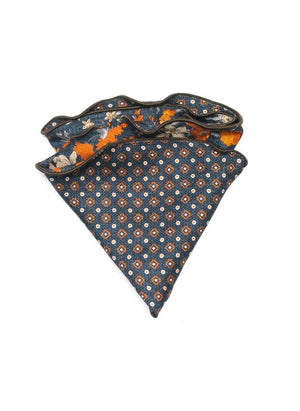 The EDWARD ARMAH Silk Reversible Pocket Circle Denim Floral features a blue denim floral print with orange, white, and beige accents and a dark border, showcased against a white background.