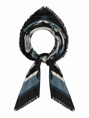 The FRANCO FERRARI - ALOE SILK SCARF 90X90 features a triangular pattern in black, blue, white, and grey with frayed edges. It can be wrapped circularly and tied loosely for a chic look.