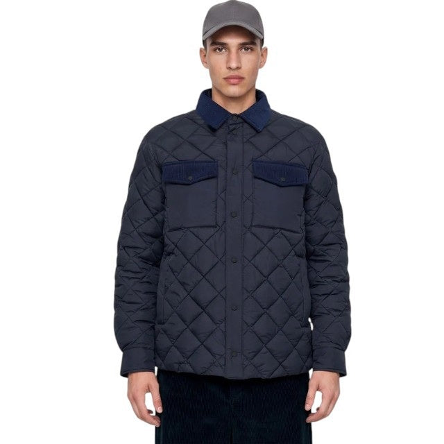The SAVE THE DUCK - FIRMIN Puffer Jacket in Blue Black by SAVE THE DUCK features a diamond-quilted design, long sleeves, snap button closures, two chest pockets with flaps, and a dark collar, presented against a plain light background.