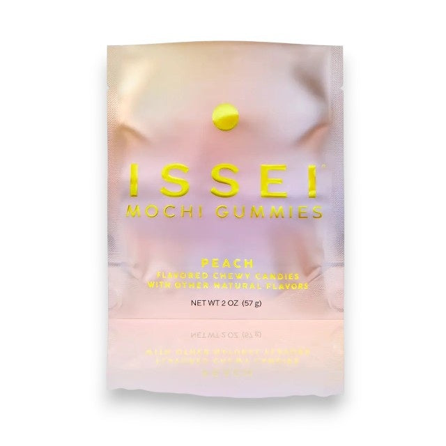 A white package of MOCHI GUMMIES - PEACH from MOCHI GUMMIES features a peach flavor label with natural flavors. Its design highlights chewy candies and notes on gluten-free and plant-based qualities. Refreshing gummies are beside the 1.76 oz (50 g) pack.