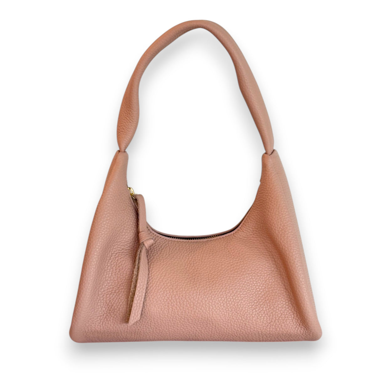 The OLIVEVE Gia Baguette Handbag in nude Italian buffalo cowhide features a pebbled texture and curved handle. It&#39;s ethically made with a zipper closure, leather pull tab, and set against a white background.