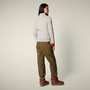 A woman with straight brown hair and a neutral expression models the SAVE THE DUCK - ZILIA JACKET in light gray, styled with olive cargo pants, red socks, and tan boots—showcasing effortless transitional layering.