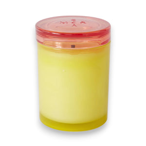 The MERSEA - FRESH CITRON JOLIE JAR CANDLE, a yellow soy wax blend candle with a pink-tinted lid from MERSEA, is displayed against a white background.