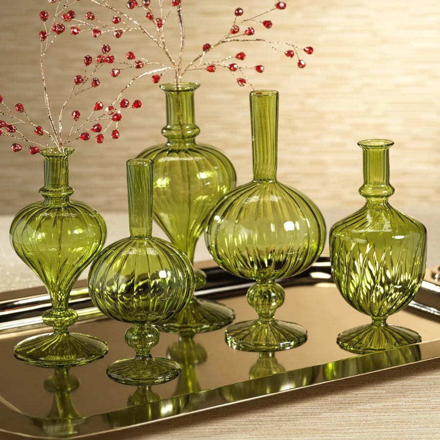 The VENETIAN SPIRAL VASE IN GREEN ONION SHAPE, 9” by ZODAX features a round, ribbed borosilicate glass body in green, a narrow neck, a small round detail at the base, and a flared circular foot—making it an elegant decorative vase.