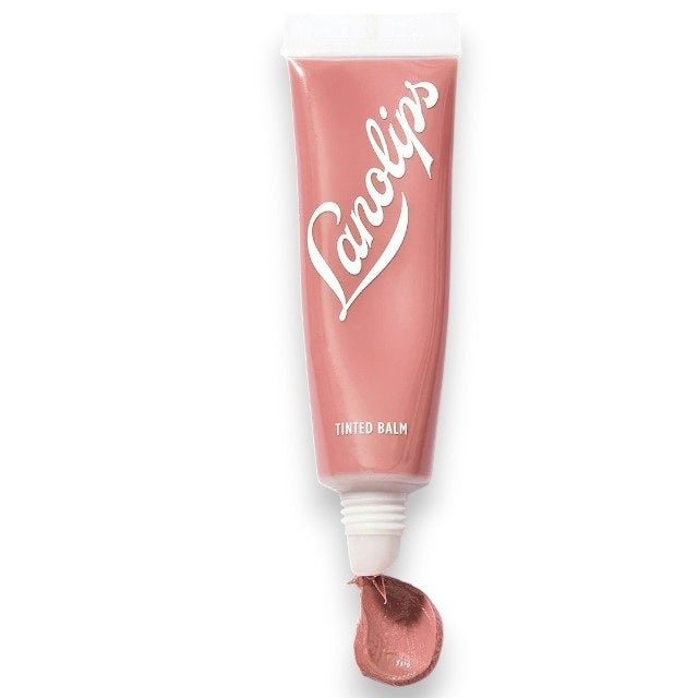 Two arms display swatches of four LANOLIPS TINTED LANOLIN LIP BALM shades—Rose, Rhubarb, Perfect Nude, and Spice—demonstrating the color differences on various skin tones against a pale blue background. The collection features options ideal for anyone wanting a nude lip tint or the nourishing benefits of a LANOLIPS lanolin lip moisturizer.