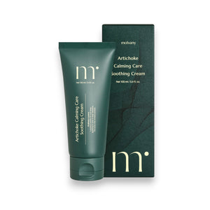 A green tube of "MOLVANY - Artichoke Calming Care Soothing Cream," enriched with calming elements, sits next to its matching box. Both feature minimalistic white text with the brand name "HONG CHEON USA, INC" at the top. It's 100 ml / 3.4 fl. oz., promising enhanced skin moisture and tranquility.