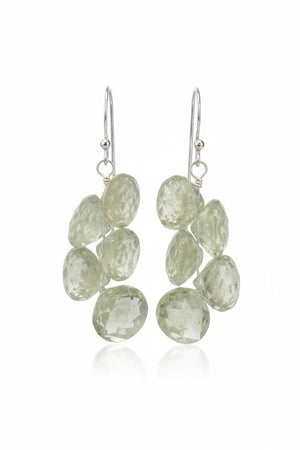 The ANN LIGHTFOOT - FACETED ONION CUT GREEN QUARTZ DROP EARRINGS feature dangling faceted gemstones in clusters. Each earring has five oval stones, including onion-cut green quartz, hanging elegantly from sterling silver hooks on a plain white backdrop.