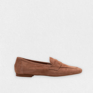 A side view showcases the MICHELE LOPRIORE - PAOLA SUEDE LOAFER in beige against a white background. This mocassin-style loafer, crafted from genuine leather, features a smooth texture with a simple design and low heel.