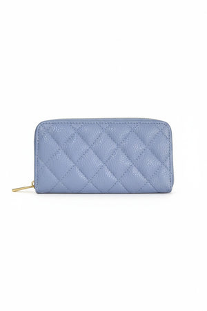 A light blue LE BORSETTE LEATHER QUILTED WALLET with diamond stitching on a white background features a zip-around closure, gold zipper pull, and multiple card slots.